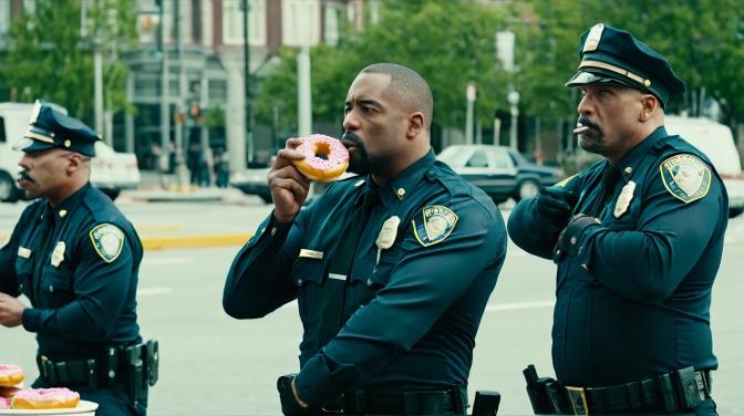Cops eating donuts.
