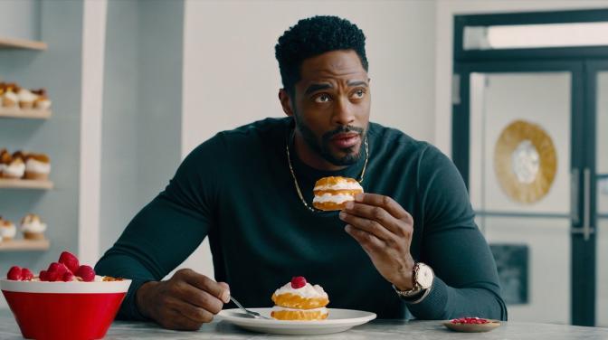 I'm in Valentine as a black guy eating pastries.