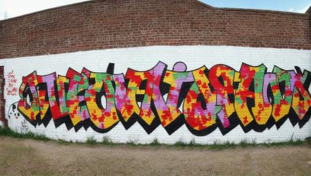 A plain brick wall with nothing on it,