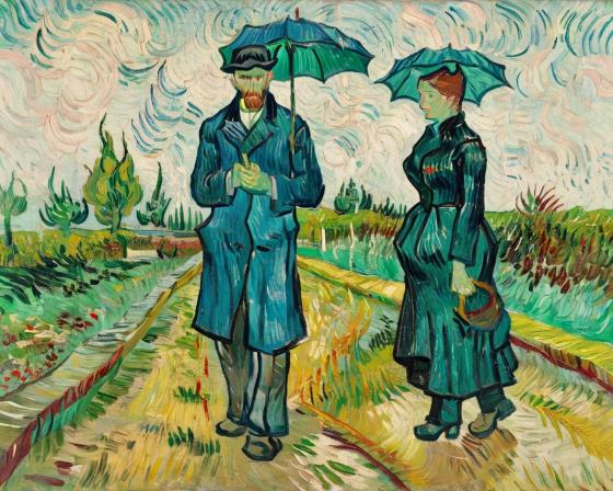 A man and woman standing in the rain.